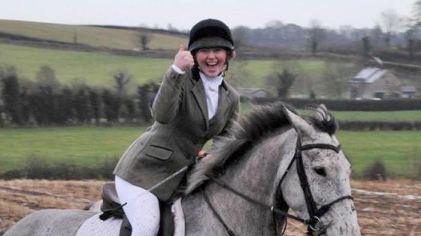 Katie Simpson riding — her passion for horses was at the heart of her life